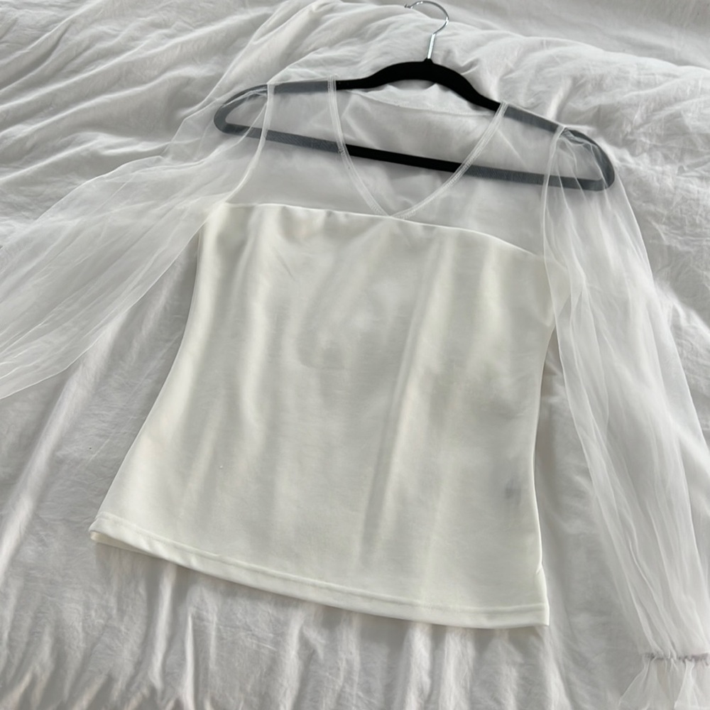 Crème sheer long sleeve top